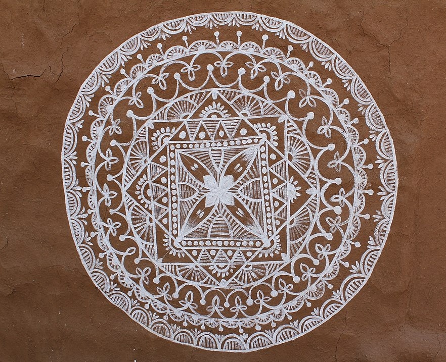 Mandana art work on the walls of rajasthani mud huts from shilpgram , udaipur